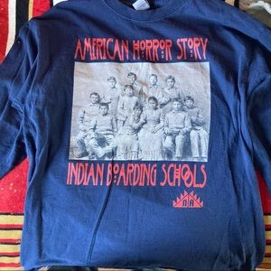 A long sleeve blue shirt that’s a large which is in good condition!:)